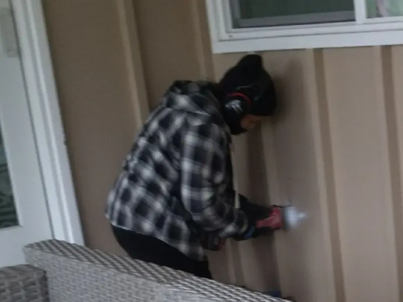 Professional electrician installing an exterior outlet in Callender